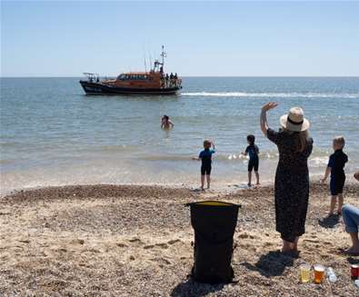 Children waving at lifeboat at Lowestoft